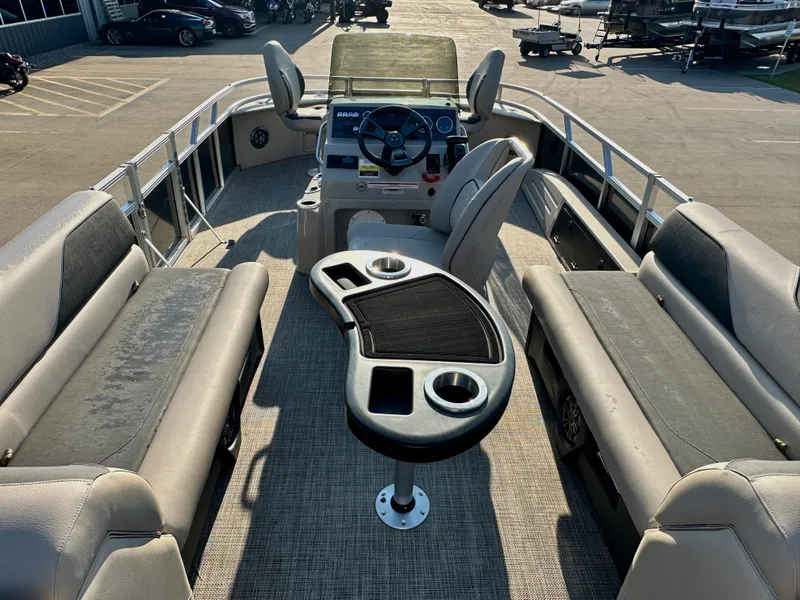 Slide: The Image of 2023 Tahoe Pontoon 25FT Sport 85 Center Console Fish interior with seating and control console. - 6