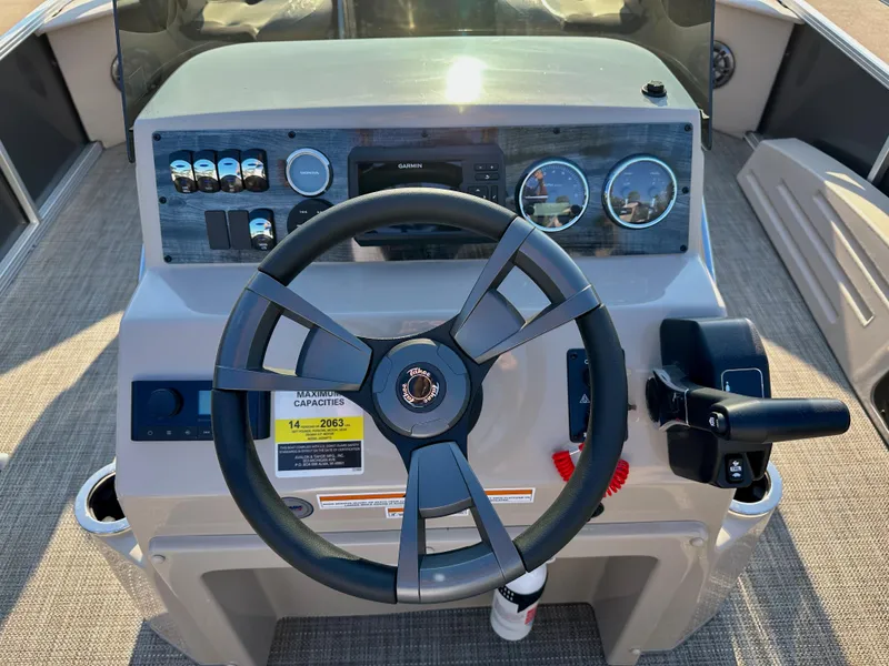 Slide: The Image of 2023 Tahoe Pontoon 25FT Sport 85 Center Console Fish dashboard and steering wheel. - 7
