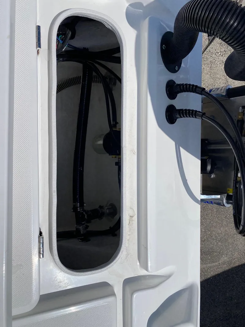 Slide: The Image of 2024 Savannah 220 IS boat interior wiring and components. - 17