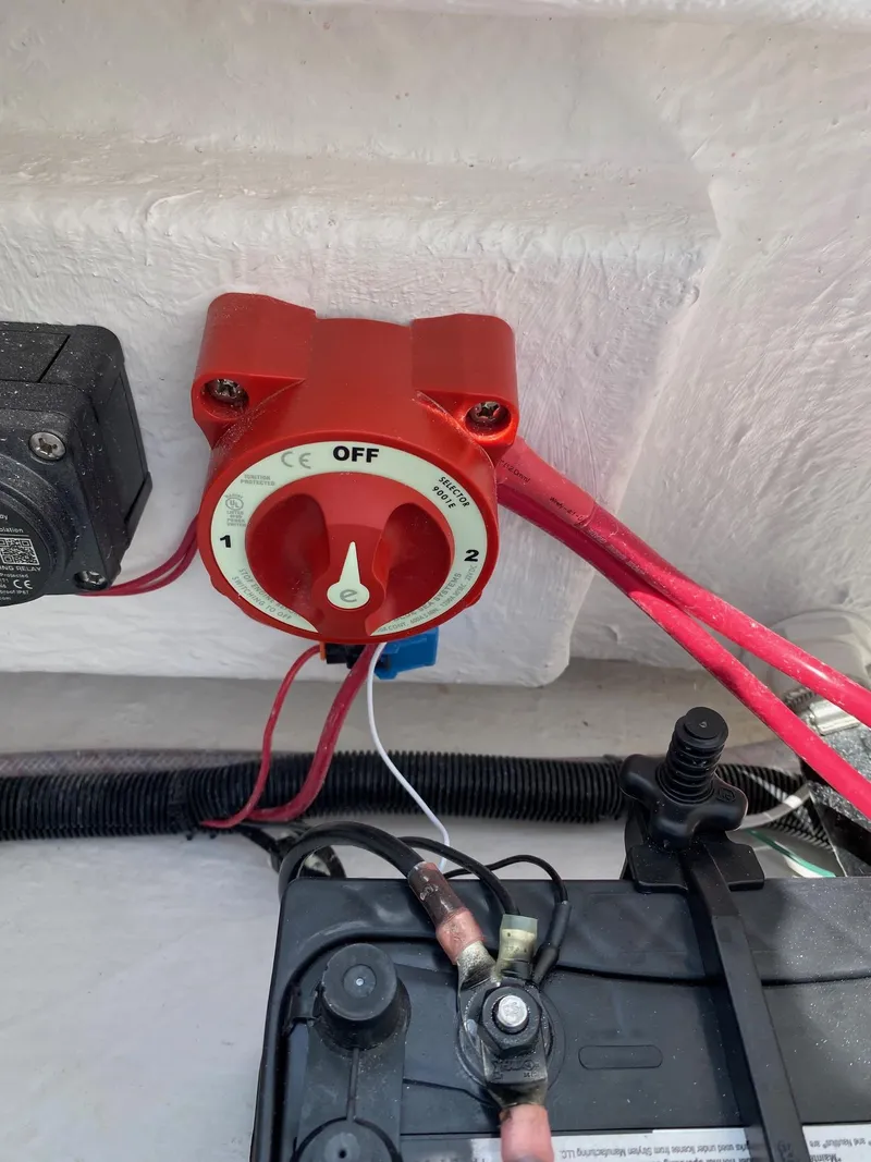 Slide: The Image of Red battery switch in a 2024 Savannah 220 IS boat. - 21