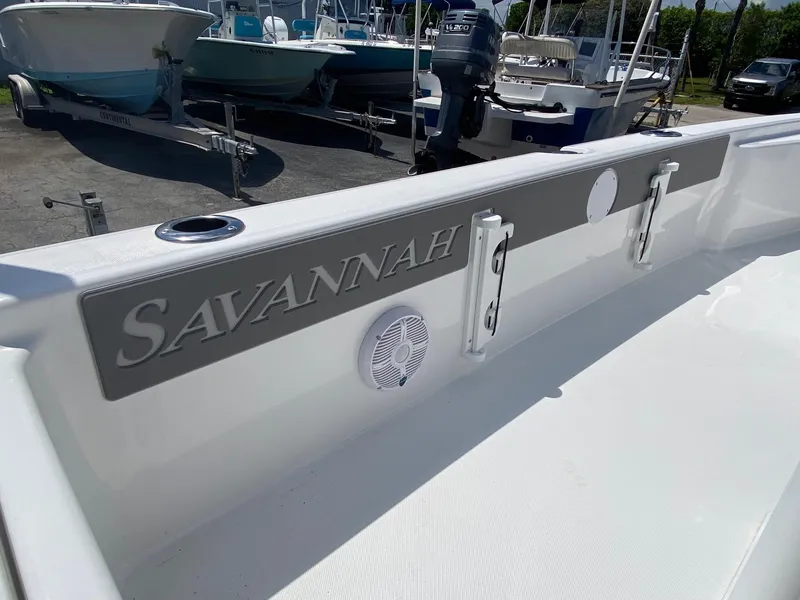 Slide: The Image of 2024 Savannah 220 IS boat interior with logo and speaker. - 23