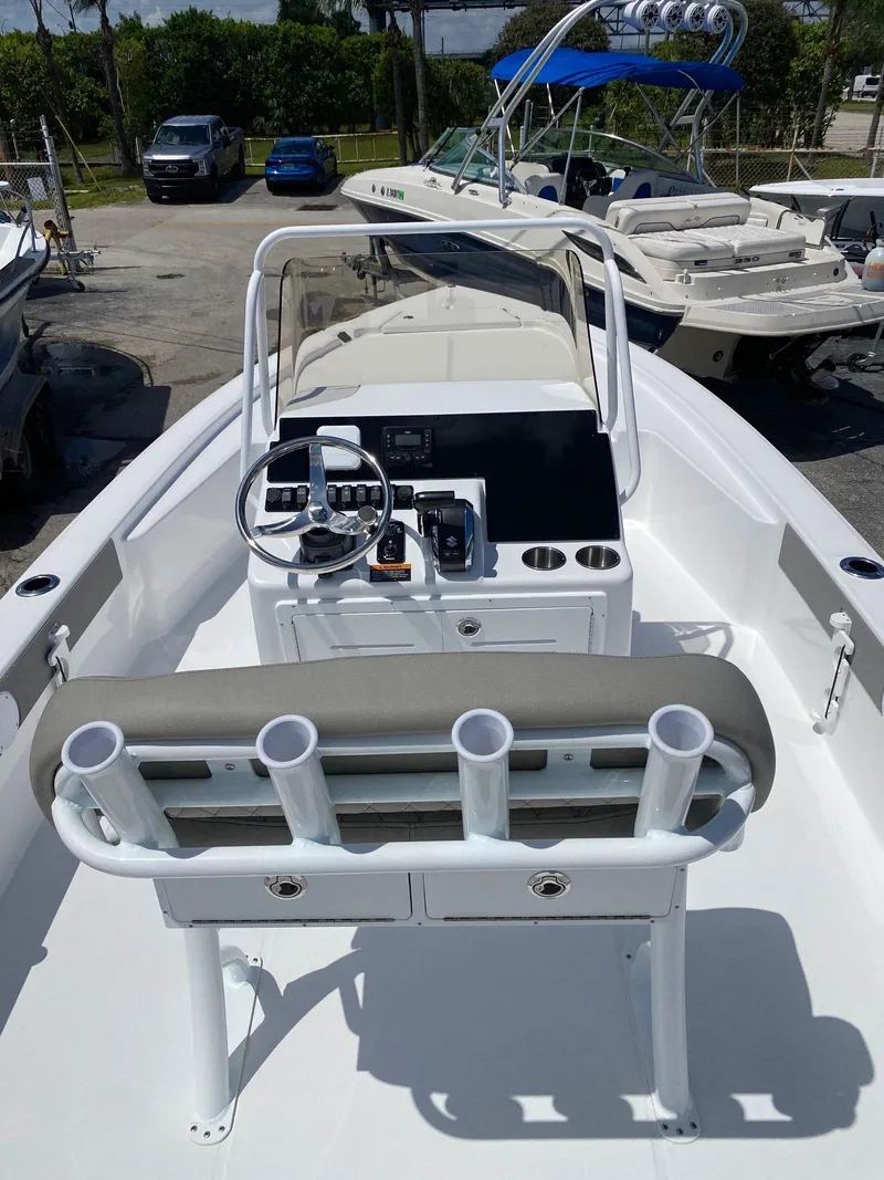 Slide: The Image of 2024 Savannah 220 IS boat with center console and rod holders. - 5