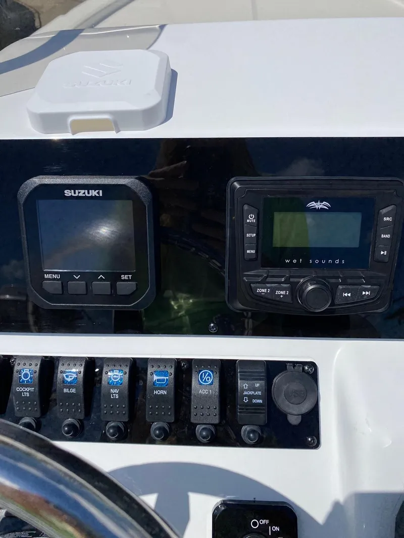 Slide: The Image of Control panel of a 2024 Savannah 220 IS boat with Suzuki and Wet Sounds displays. - 9