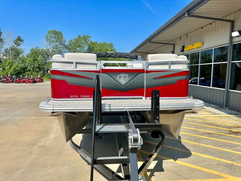 Slide: The Image of 2023 Tahoe Pontoon 19FT STX Cruise in red, parked outside dealership. - 4