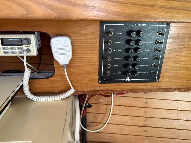 Slide: The Image of 1986 J Boats J30 control panel and radio equipment. - 7
