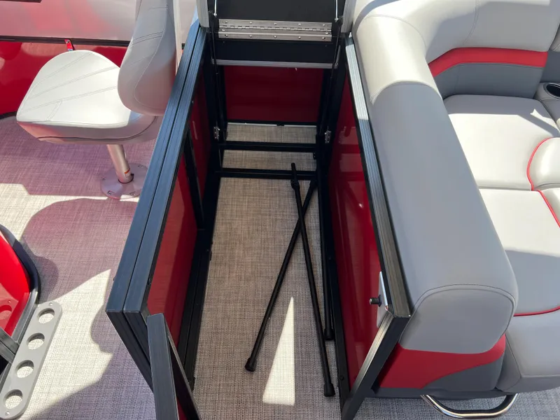 Slide: The Image of 2023 South Bay 22F 200 Series boat interior storage compartment with seating. - 11