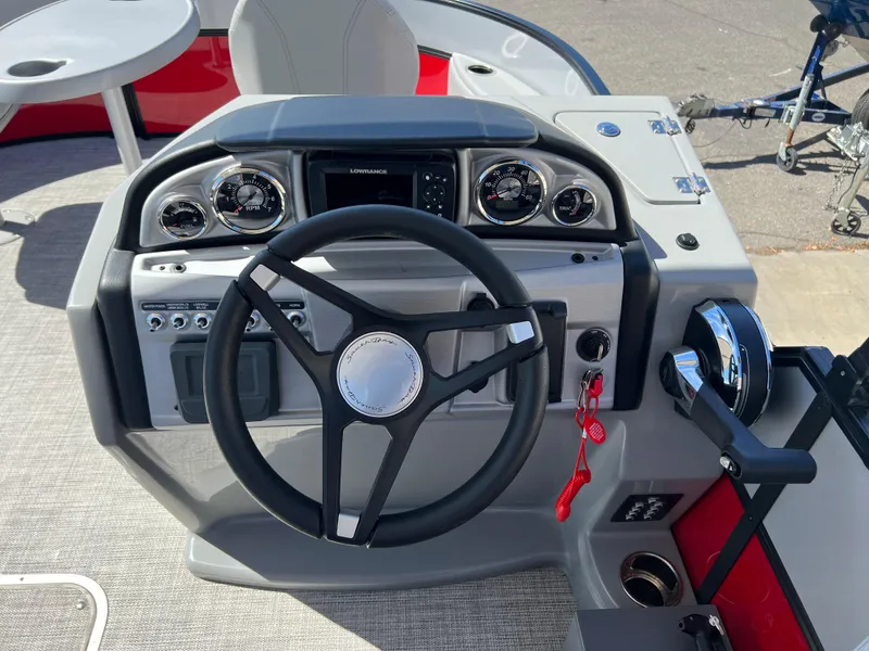 Slide: The Image of 2023 South Bay 22F 200 Series boat dashboard with steering wheel and control panel. - 14