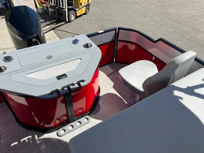 Slide: The Image of 2023 South Bay 22F 200 Series boat interior with red and gray seating. - 15