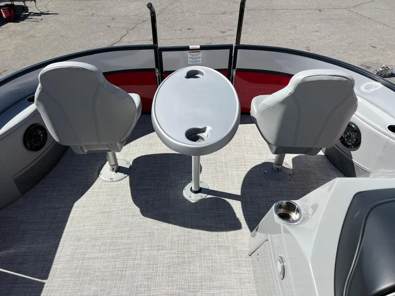 Slide: The Image of 2023 South Bay 22F 200 Series boat interior with seating and table. - 21