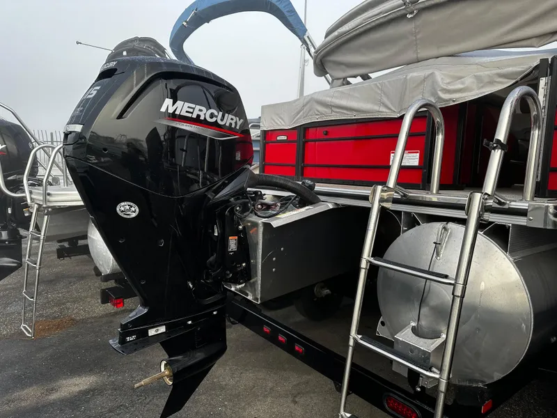 Slide: The Image of 2023 South Bay 22F 200 Series pontoon boat with Mercury outboard motor. - 3