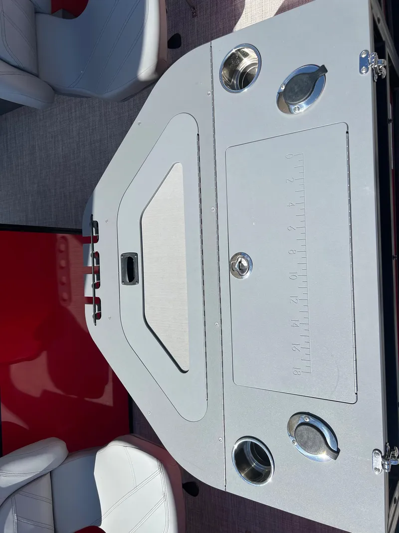 Slide: The Image of 2023 South Bay 22F 200 Series boat interior with seating and storage compartments. - 8