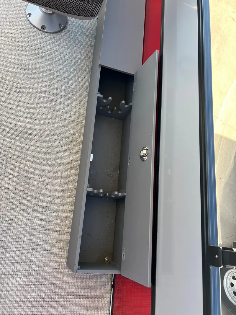 Slide: The Image of Open storage compartment in a 2023 South Bay 22F 200 Series boat. - 9