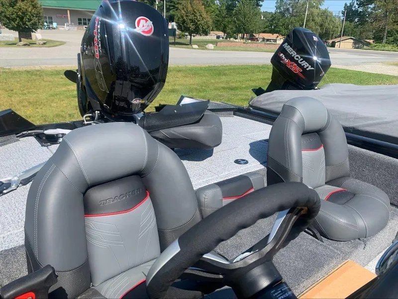 Slide: The Image of 2024 Tracker PT 195 XTE boat interior with Mercury outboard motor. - 6