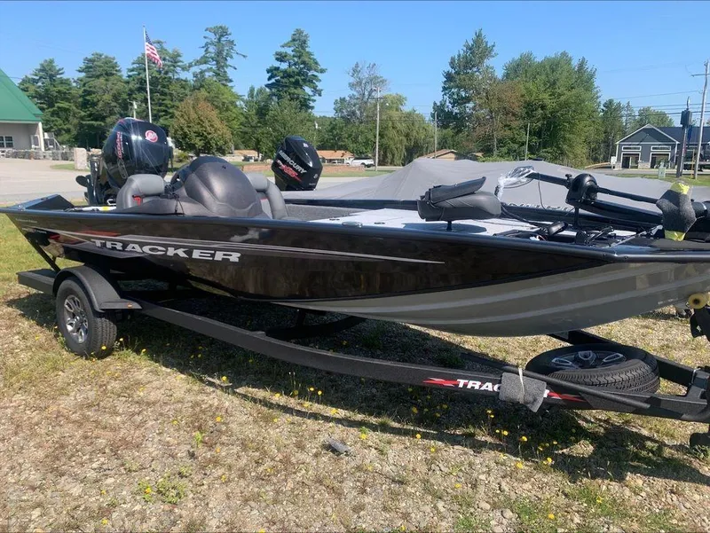 Slide: The Image of 2024 Tracker PT 195 XTE fishing boat on trailer in outdoor setting. - 7