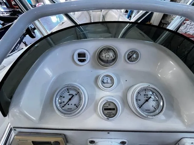 Slide: The Image of 1998 Nautica RIB 18 Widebody dashboard with gauges and controls. - 11
