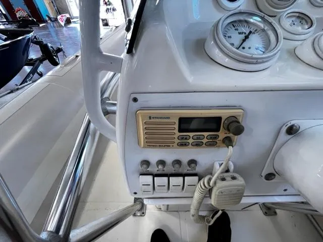 Slide: The Image of Control panel of a 1998 Nautica RIB 18 Widebody boat with radio and gauges. - 12