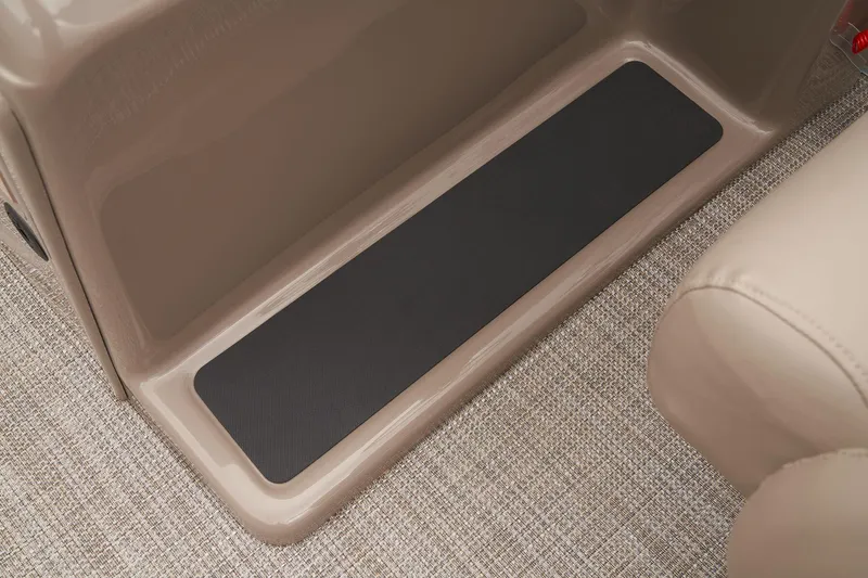 Slide: The Image of 2024 Ranger Reata 200C interior step with non-slip mat and carpeted flooring. - 23