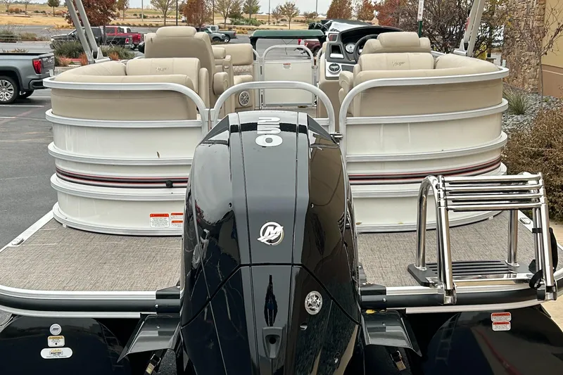 Slide: The Image of 2023 Ranger Reata 243C pontoon boat with Mercury outboard motor. - 3