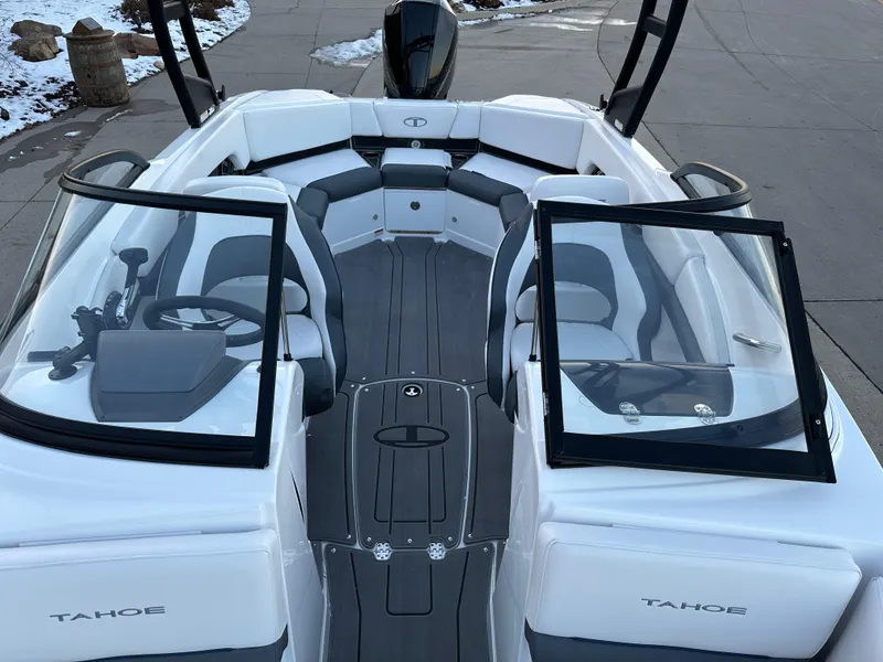Slide: The Image of 2024 Tahoe 210 S boat interior with seating and windshield. - 11