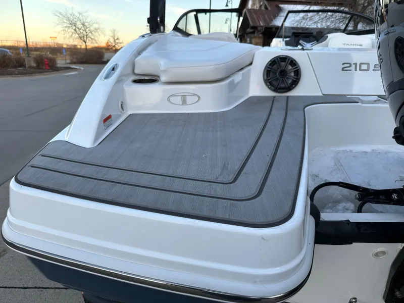 Slide: The Image of 2024 Tahoe 210 S boat rear deck with seating and speaker. - 13