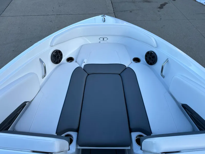 Slide: The Image of 2024 Tahoe 210 S boat bow seating area with speakers and cup holders. - 3