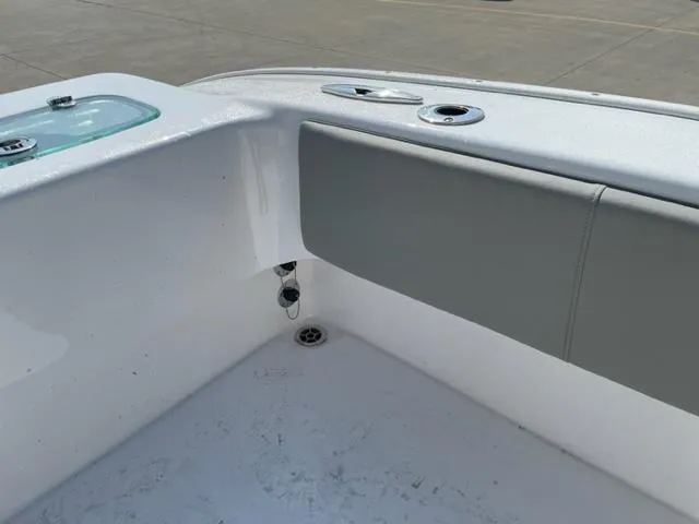 Slide: The Image of 2024 Cape Horn 31T boat interior corner with cushioned seating and storage compartment. - 14