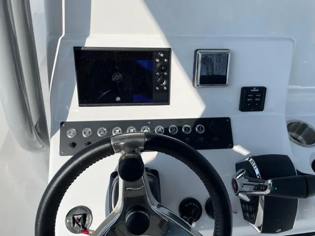 Slide: The Image of 2024 Cape Horn 31T boat dashboard with steering wheel and control panel. - 16
