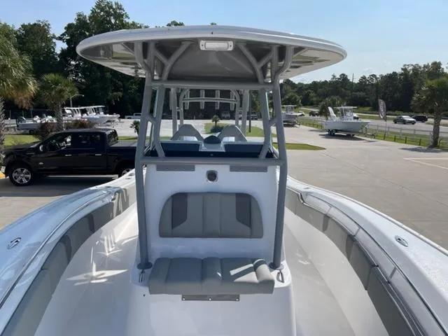 Slide: The Image of 2024 Cape Horn 31T boat with T-top and seating, docked in a marina. - 24