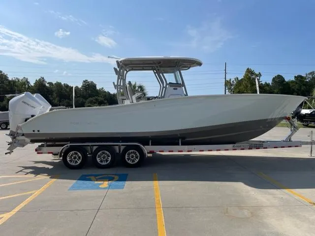 Slide: The Image of 2024 Cape Horn 31T boat on a trailer in a parking lot. - 3