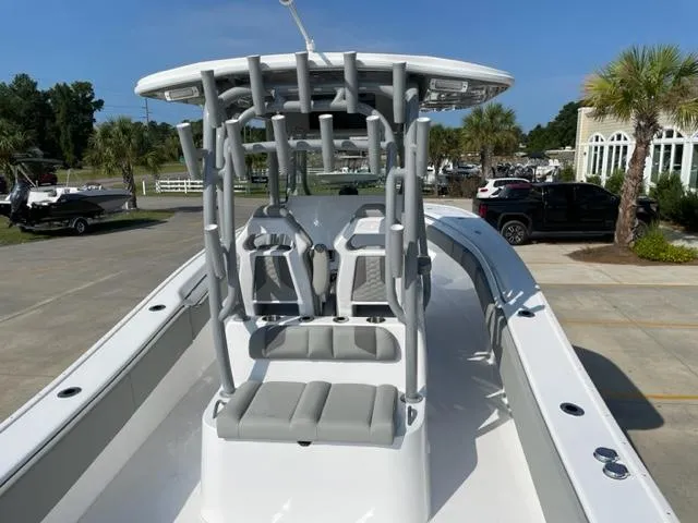 Slide: The Image of 2024 Cape Horn 31T boat with T-top and seating, docked in a marina. - 9