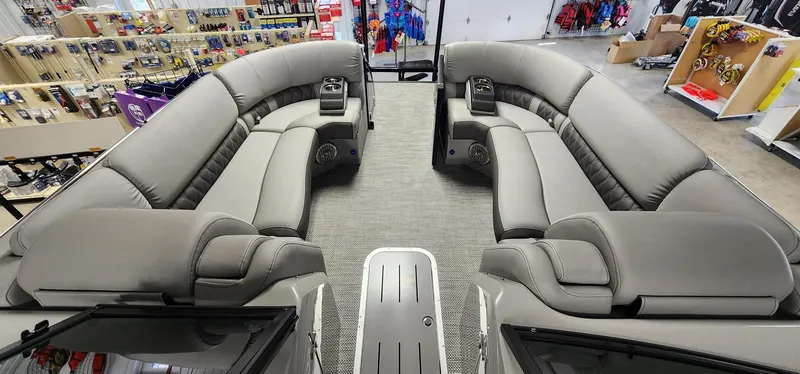 Slide: The Image of 2024 Bennington 25QXSBA pontoon boat interior with luxurious gray seating. - 11
