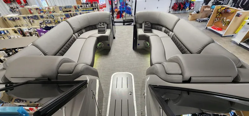 Slide: The Image of 2024 Bennington 25QXSBA boat interior with luxurious seating and modern design. - 13