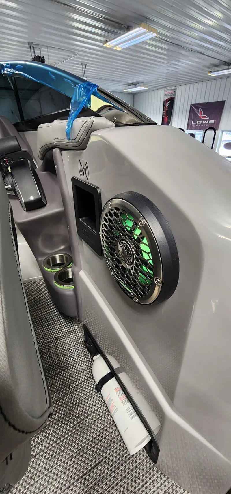 Slide: The Image of 2024 Bennington 25QXSBA boat interior with speaker and cup holders. - 14