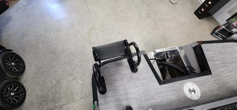 Slide: The Image of 2024 Bennington 25QXSBA boat interior with steering wheel and control panel. - 6