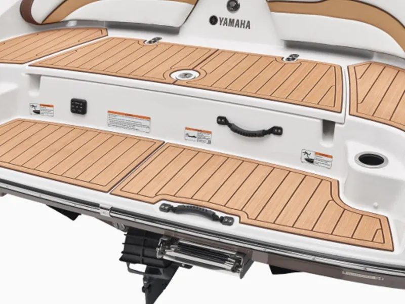 Slide: The Image of 2023 Yamaha Boats 195S swim platform with teak-style decking and retractable ladder. - 4