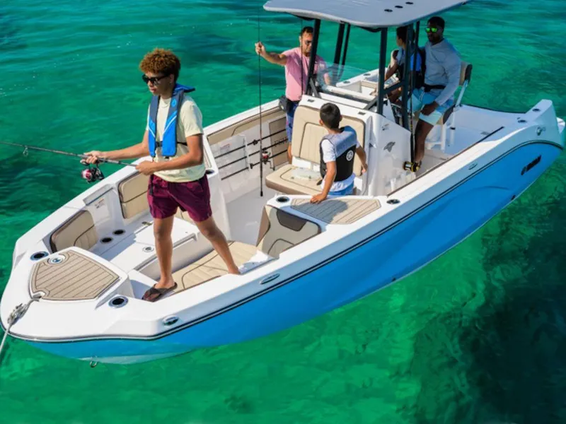 Slide: The Image of 2024 Yamaha Boats 222 FSH Sport on clear turquoise water with people fishing. - 3