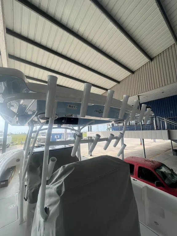 Slide: The Image of 2024 Fountain 34 TE boat under covered storage. - 20