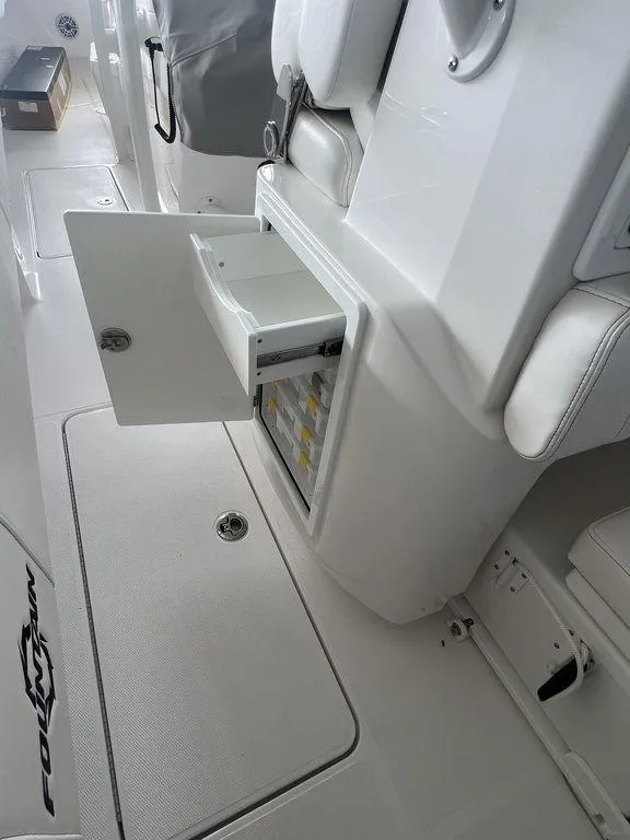 Slide: The Image of 2024 Fountain 34 TE boat interior with open storage compartment. - 21