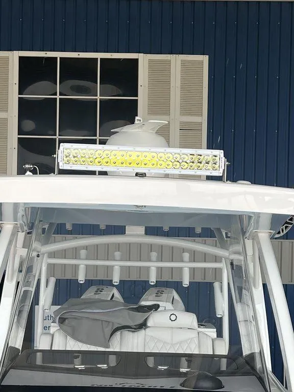 Slide: The Image of 2024 Fountain 34 TE boat with LED light bar and cushioned seating. - 32