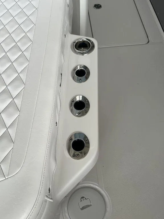 Slide: The Image of 2024 Fountain 34 TE boat interior with cup holders and quilted seating. - 34