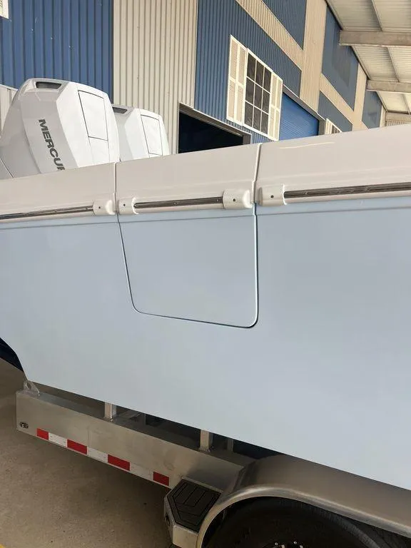 Slide: The Image of 2024 Fountain 34 TE boat on trailer with Mercury engines. - 4