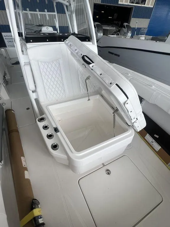 Slide: The Image of 2024 Fountain 34 TE boat with open storage compartment. - 41