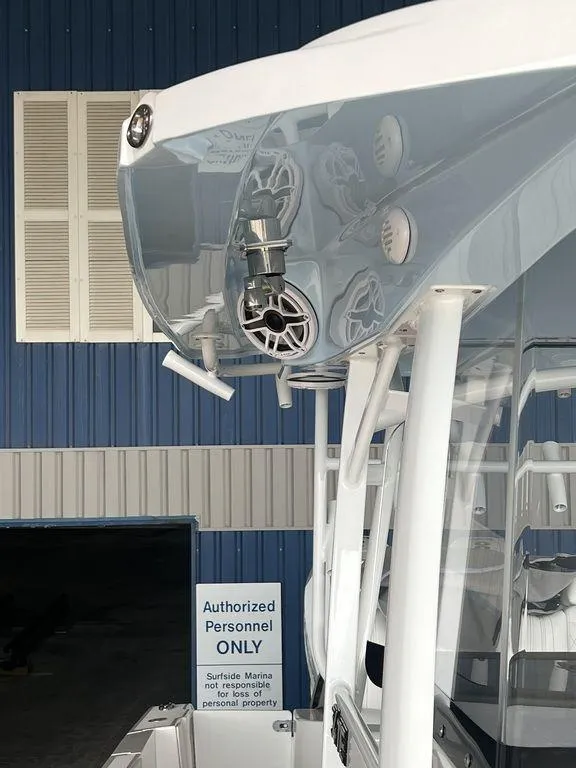 Slide: The Image of 2024 Fountain 34 TE boat detail at a marina with authorized personnel sign. - 42