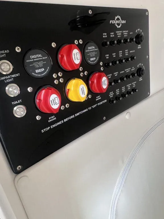Slide: The Image of Control panel of a 2024 Fountain 34 TE boat with switches and indicators. - 45