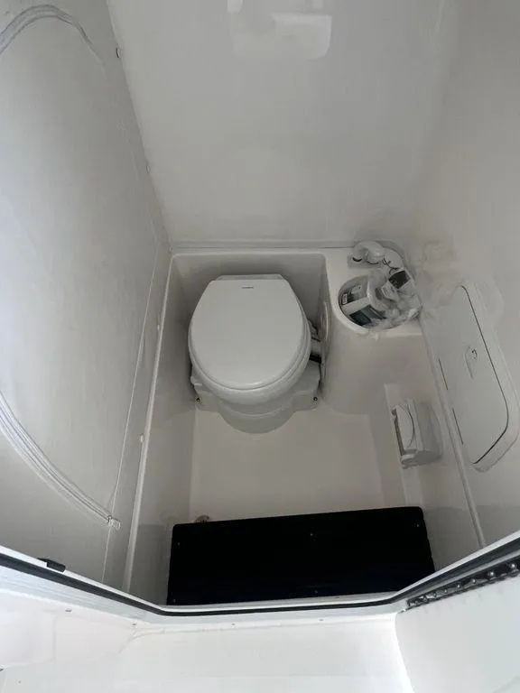 Slide: The Image of 2024 Fountain 34 TE boat interior bathroom with toilet. - 46