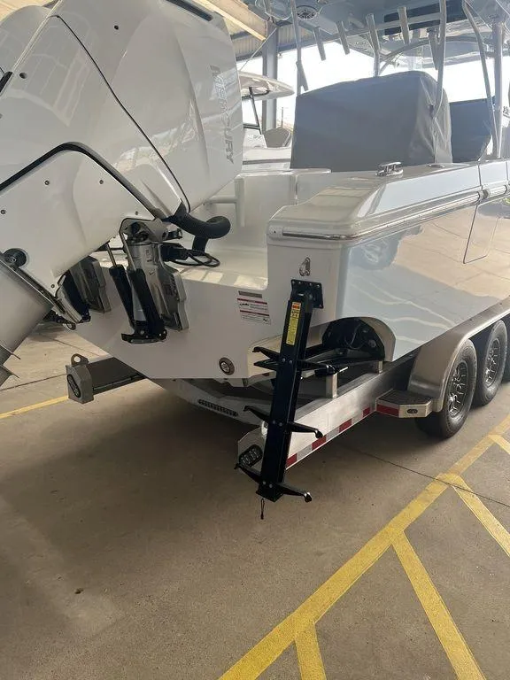 Slide: The Image of 2024 Fountain 34 TE boat on trailer, rear view showing outboard motor. - 6