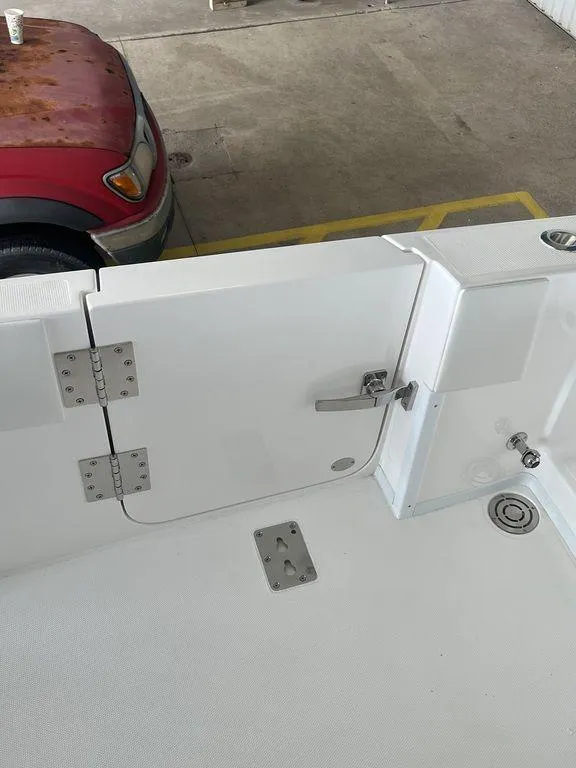 Slide: The Image of 2024 Fountain 34 TE boat interior with white deck and stainless steel fittings. - 7