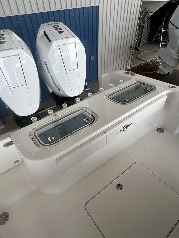 Slide: The Image of 2024 Fountain 34 TE boat with twin outboard motors and live wells. - 8