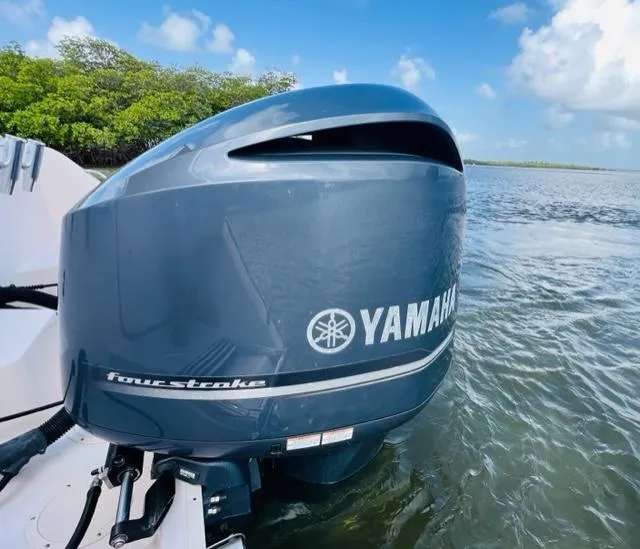 Slide: The Image of Yamaha four-stroke outboard motor on a 2014 Grady-White Freedom 335 boat. - 10