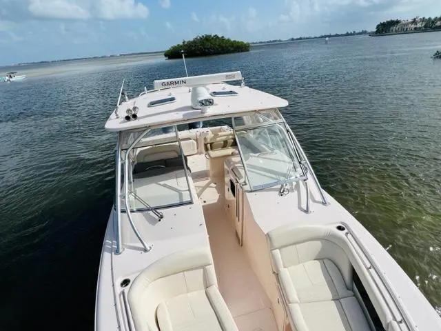 Slide: The Image of 2014 Grady-White Freedom 335 boat on calm waters with island in background. - 16
